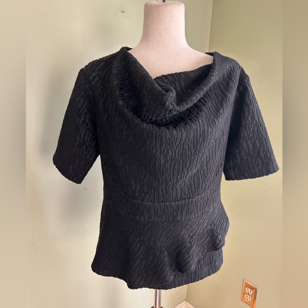 NWT Neville Wisdom Black dressy top 10. Unique neckline, black on black print